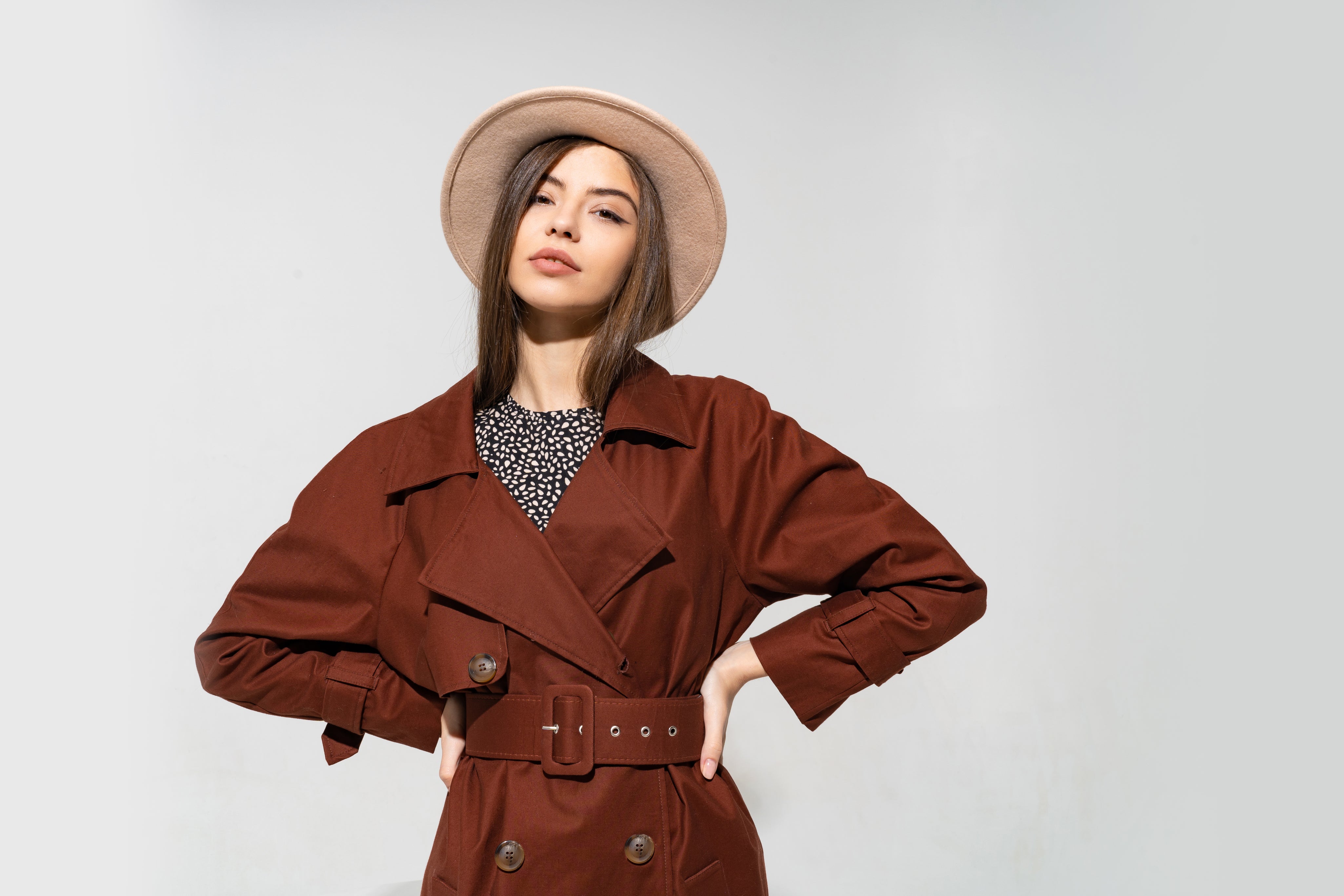 fashionable-woman-brown-coat-beige-hat-posing.jpg